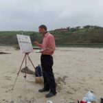 Domingo de la Lastra pintando en la playa